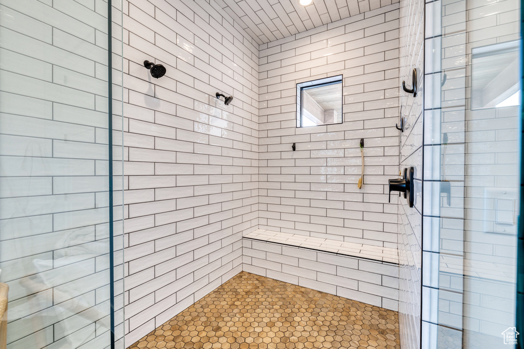 Bathroom featuring a tile shower