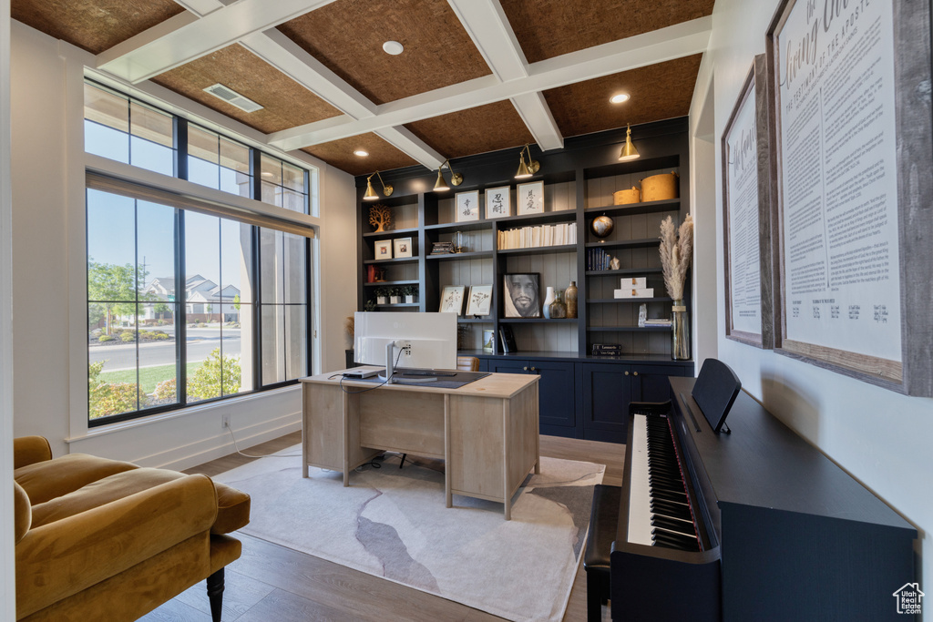 Office space with visible vents, beam ceiling, light wood-style floors, recessed lighting, and coffered ceiling