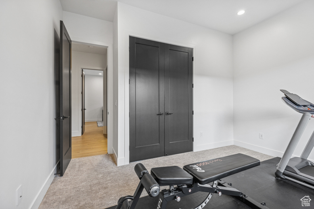 Workout area featuring recessed lighting, baseboards, and carpet floors