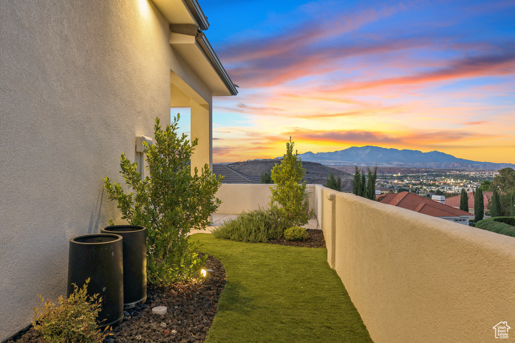 View of yard with a mountain view and a balcony