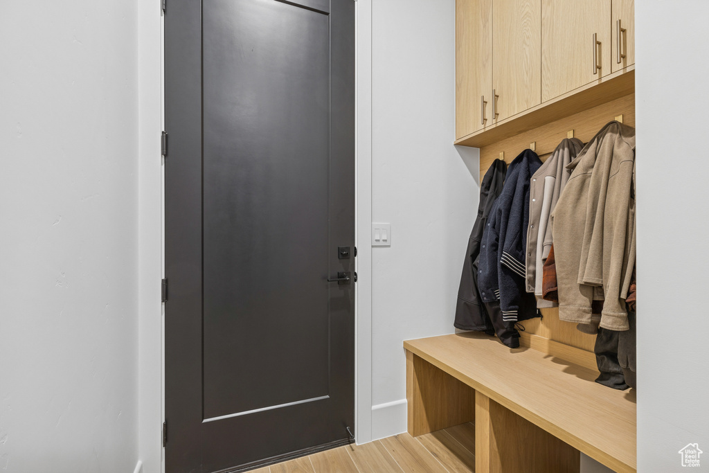 Mudroom featuring light wood finished floors