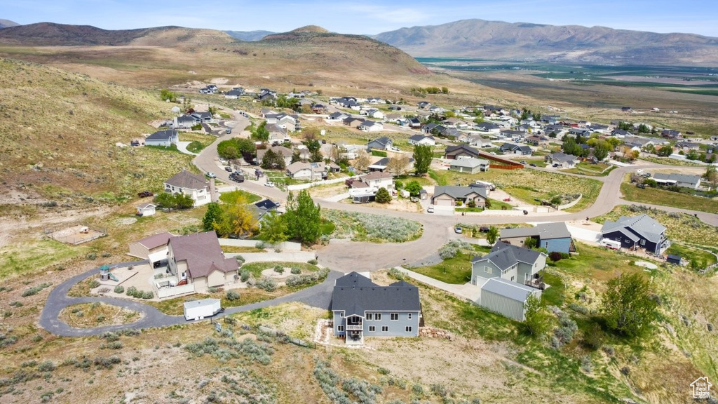 Drone / aerial view featuring a mountain view and a residential view