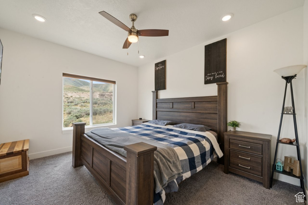 Carpeted bedroom with baseboards, a ceiling fan, and recessed lighting