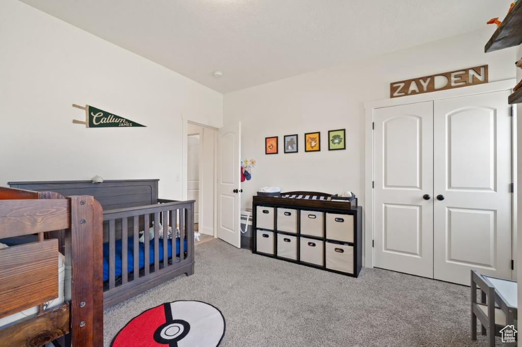 Bedroom with carpet flooring and a closet