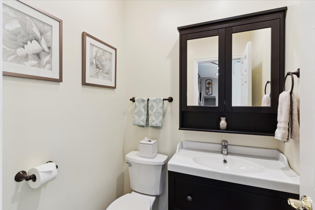Bathroom featuring vanity and toilet