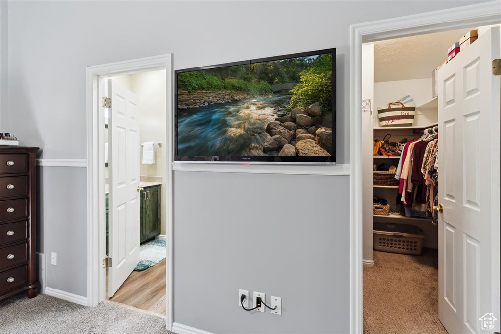 Interior space featuring baseboards and light carpet