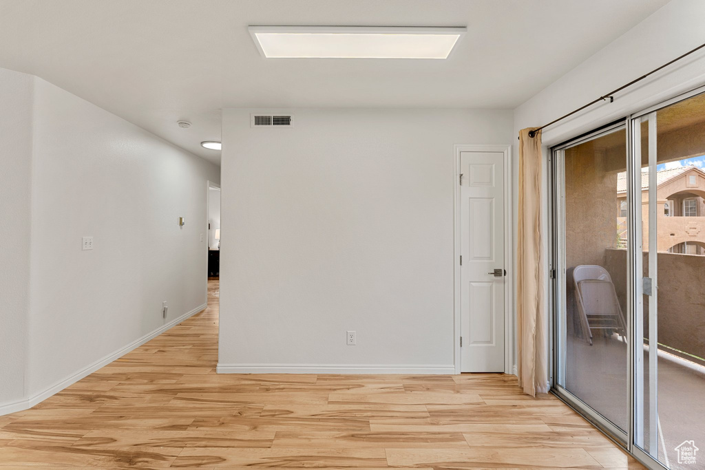 Unfurnished room with visible vents, recessed lighting, light wood finished floors, and baseboards