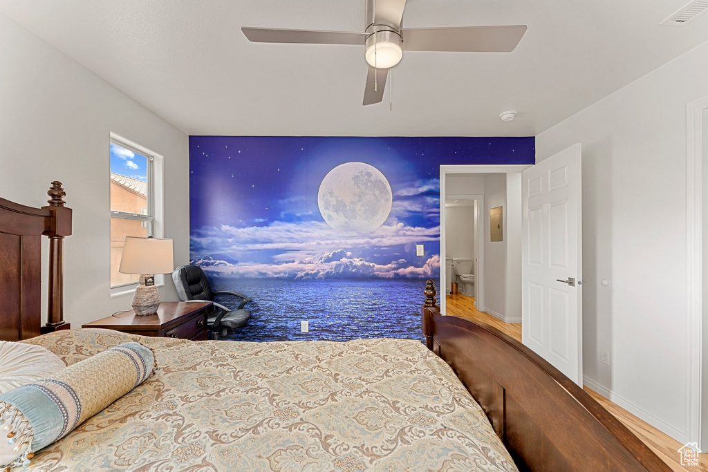 Bedroom featuring visible vents, baseboards, ceiling fan, and wood finished floors