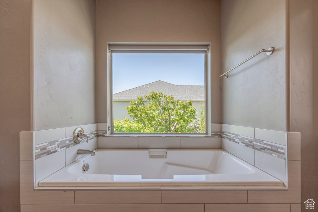 Full bathroom with a bath