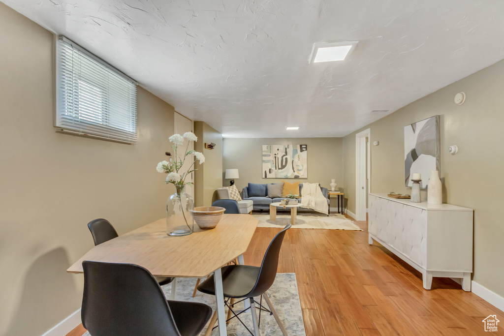 Dining room featuring light wood finished floors and baseboards
