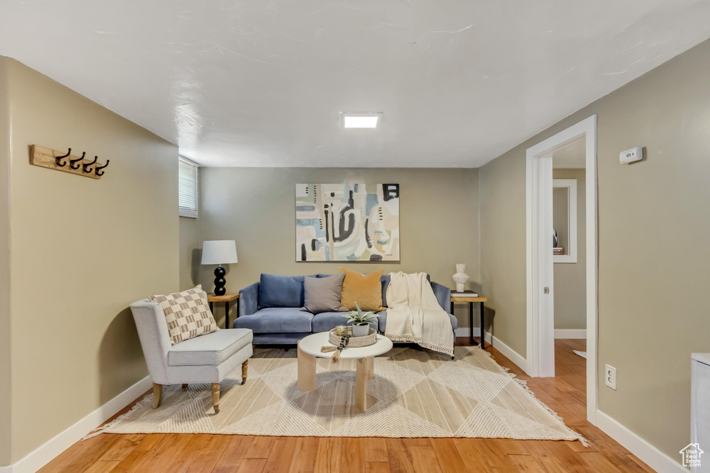 Living room featuring baseboards and light wood finished floors