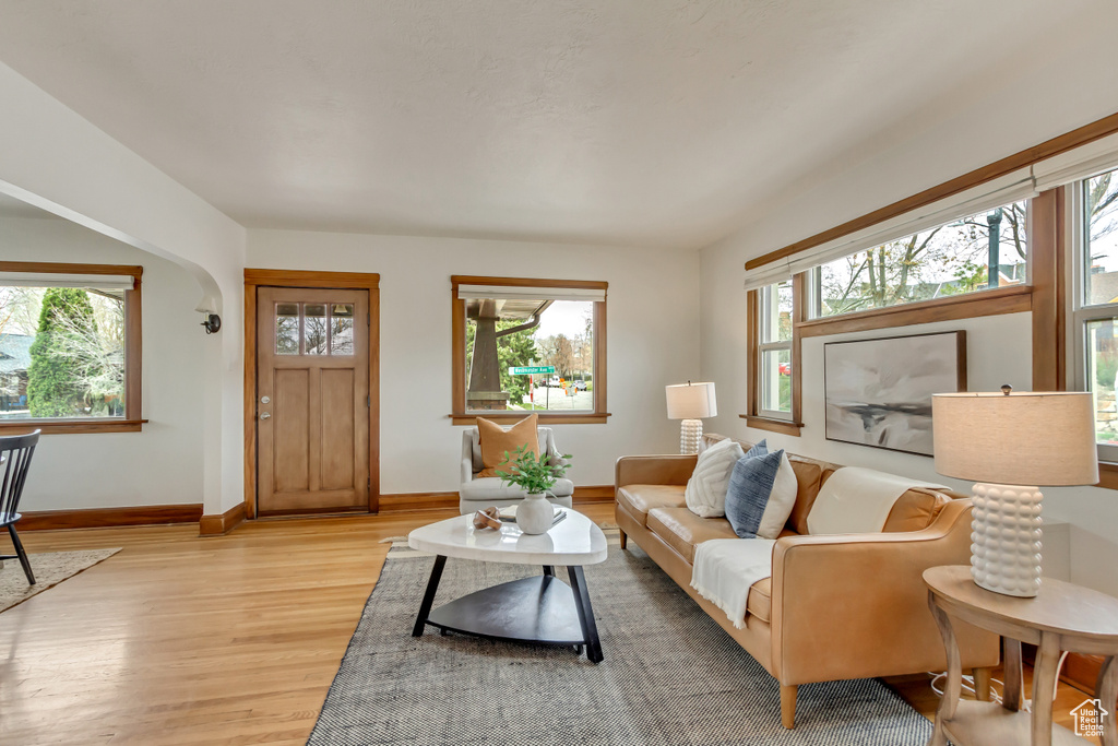 Living area featuring light wood-style flooring and baseboards