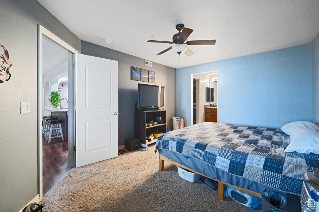 Bedroom with baseboards, carpet floors, a ceiling fan, and visible vents