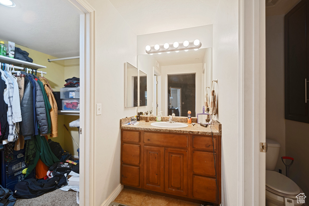 Bathroom featuring toilet and vanity