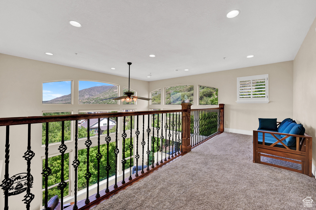 Interior space with baseboards, recessed lighting, carpet, and a mountain view