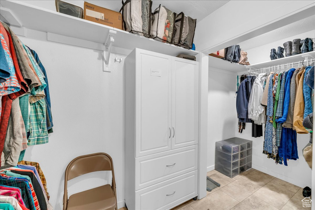 Spacious closet featuring light tile patterned floors