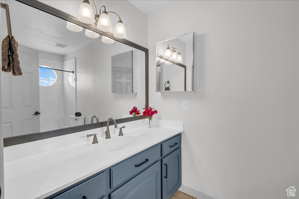 Bathroom with visible vents and vanity