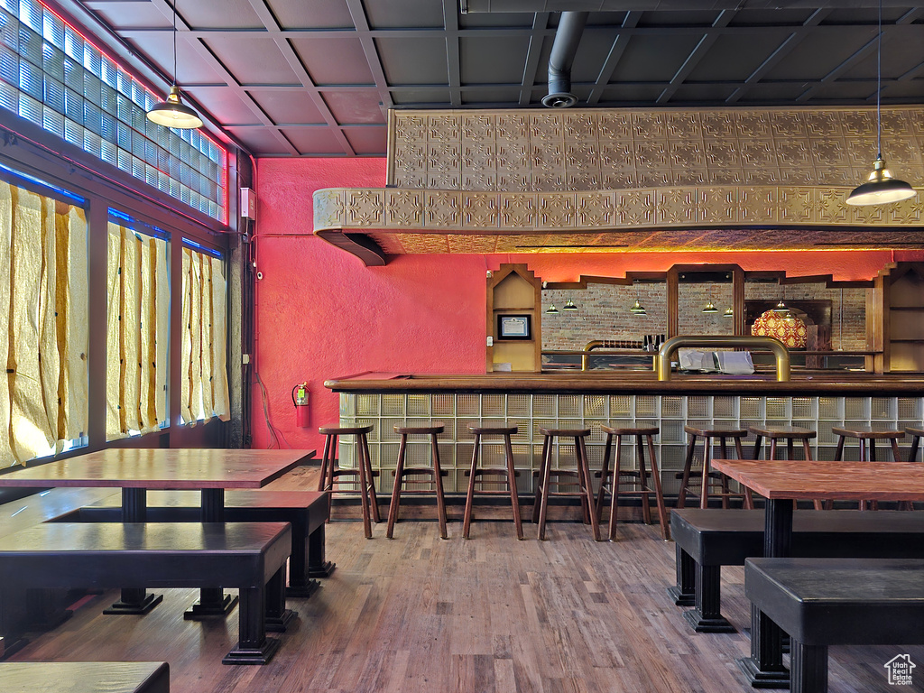Interior space with a textured wall and wood finished floors