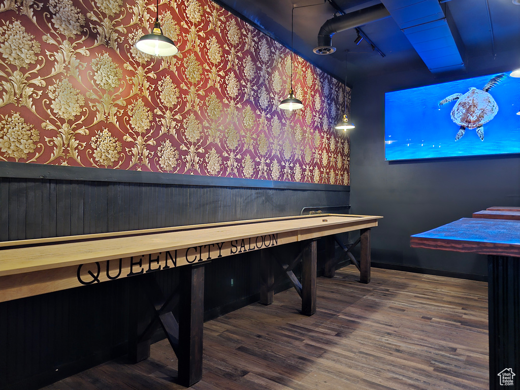 Playroom featuring a wainscoted wall, wood finished floors, and wallpapered walls