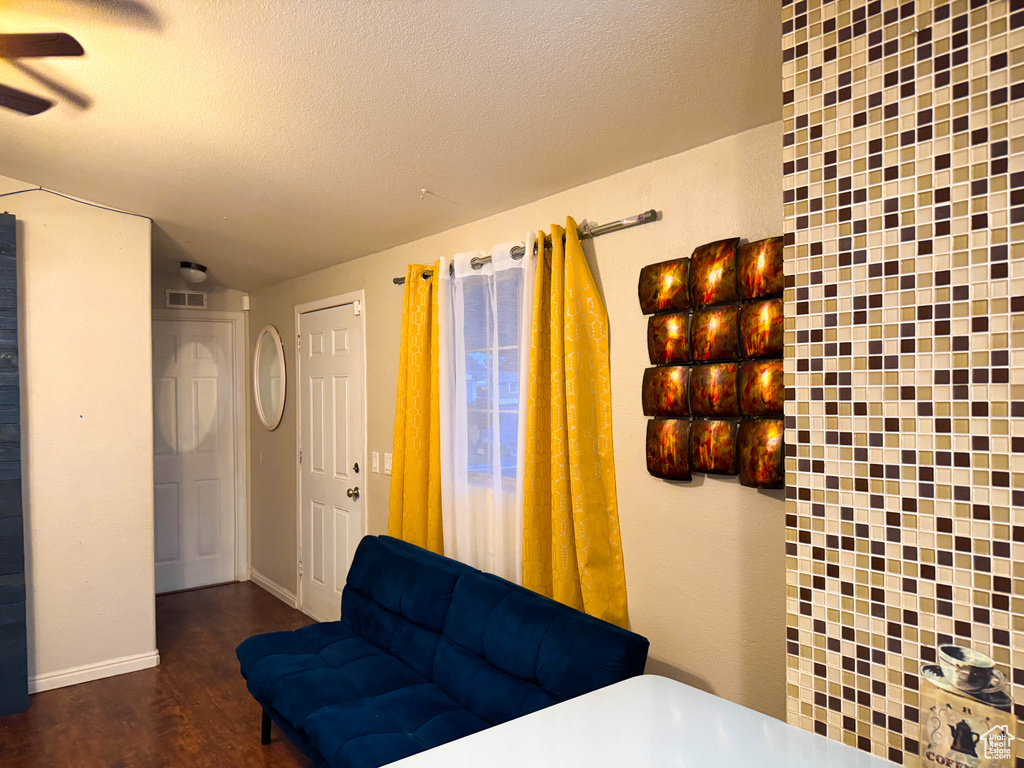 Bedroom with visible vents, a textured ceiling, and wood finished floors