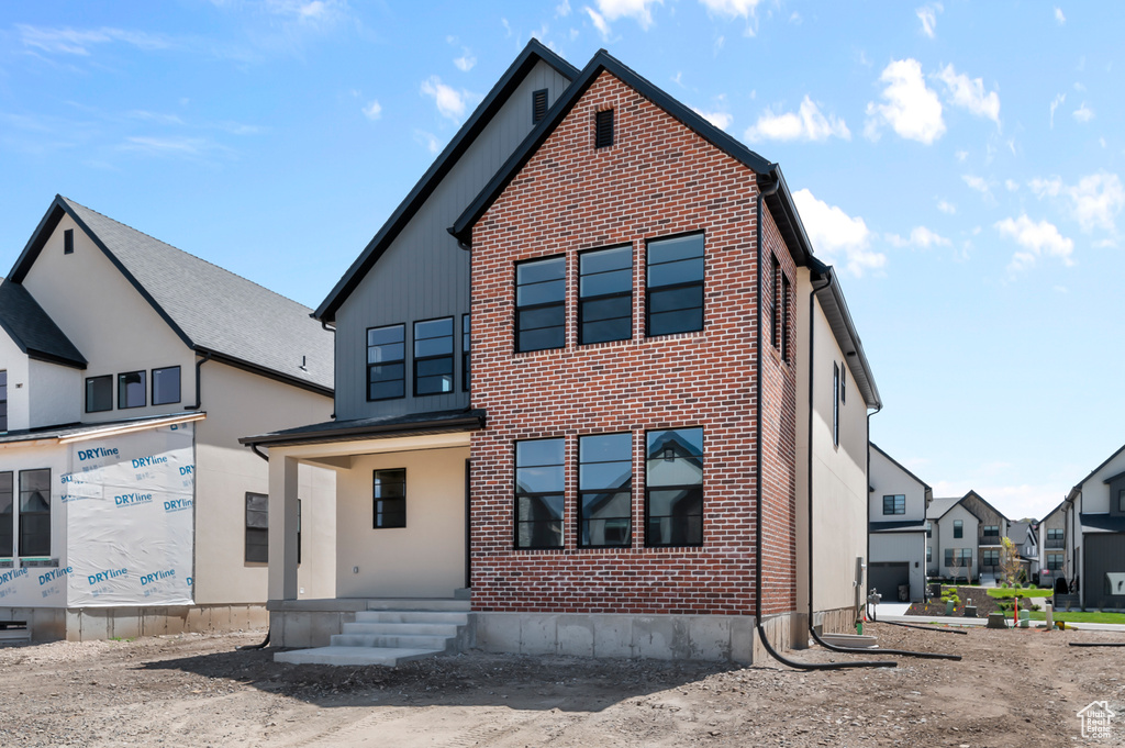 View of front of property with brick siding
