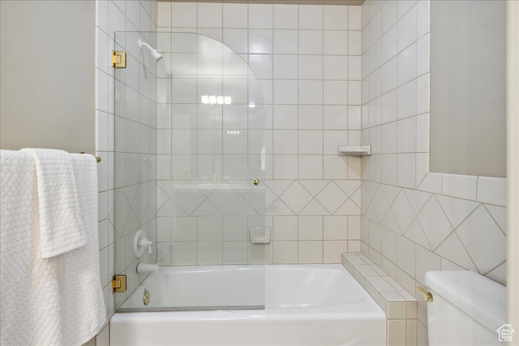 Full bathroom featuring  shower combination and toilet