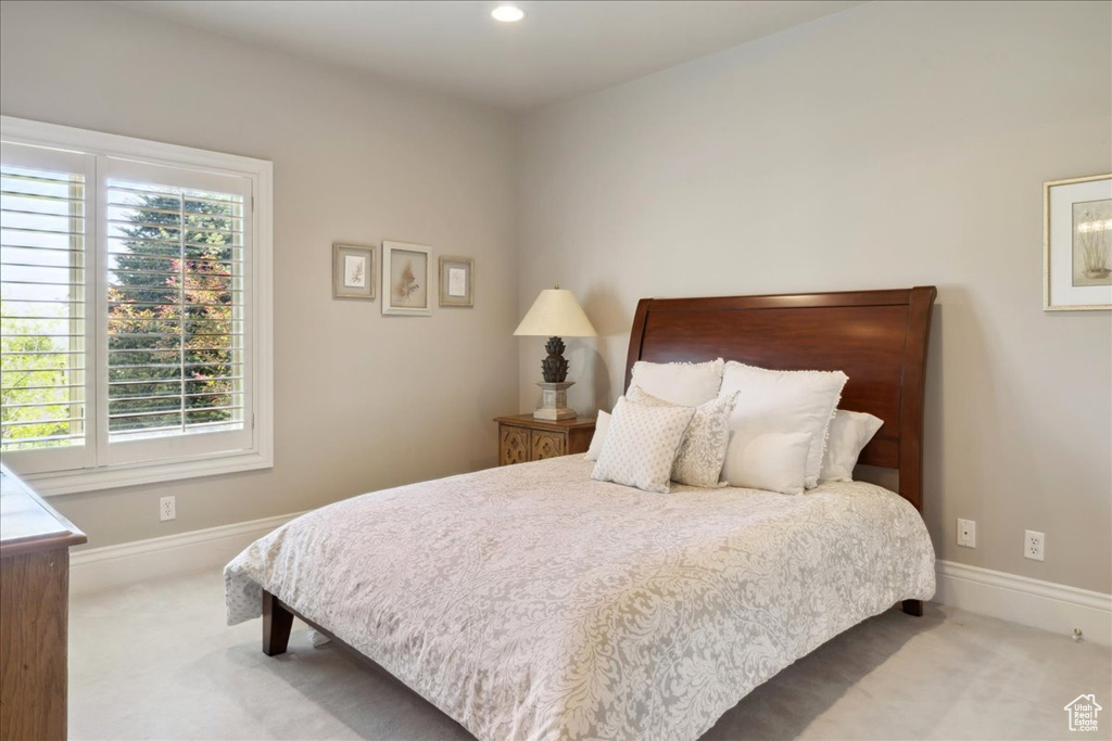 Bedroom featuring carpet flooring, baseboards, and recessed lighting
