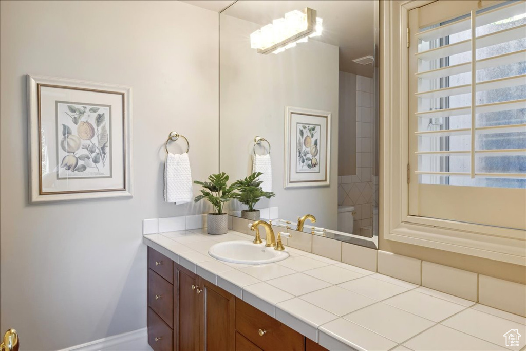 Bathroom with toilet and vanity