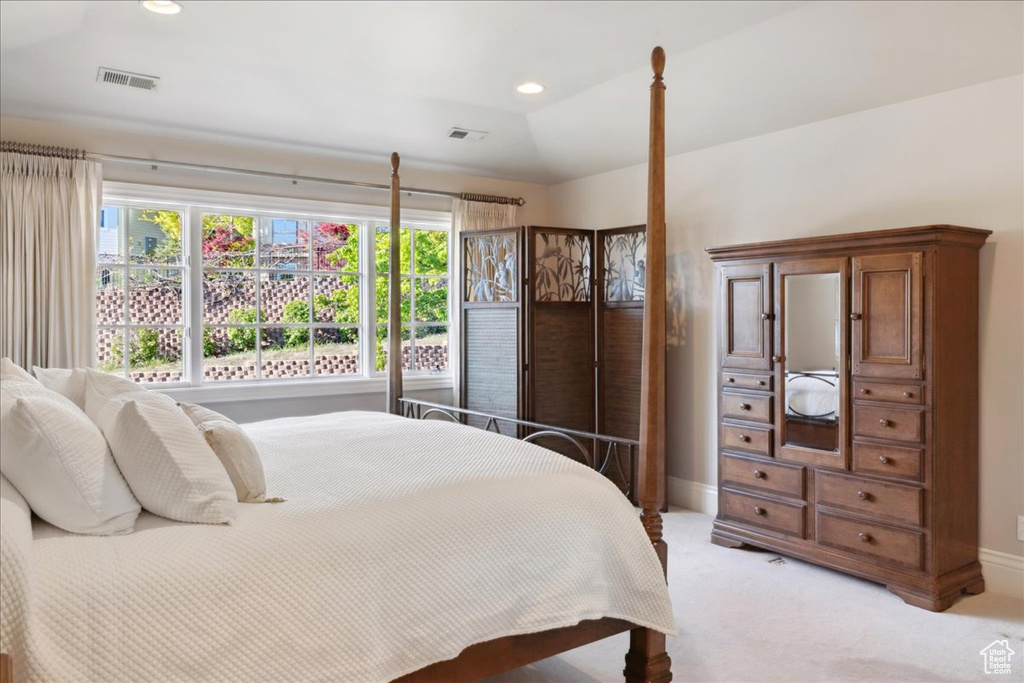Bedroom with baseboards, recessed lighting, light carpet, and visible vents