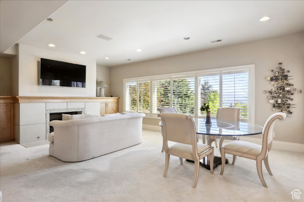 Interior space featuring light colored carpet, baseboards, and recessed lighting