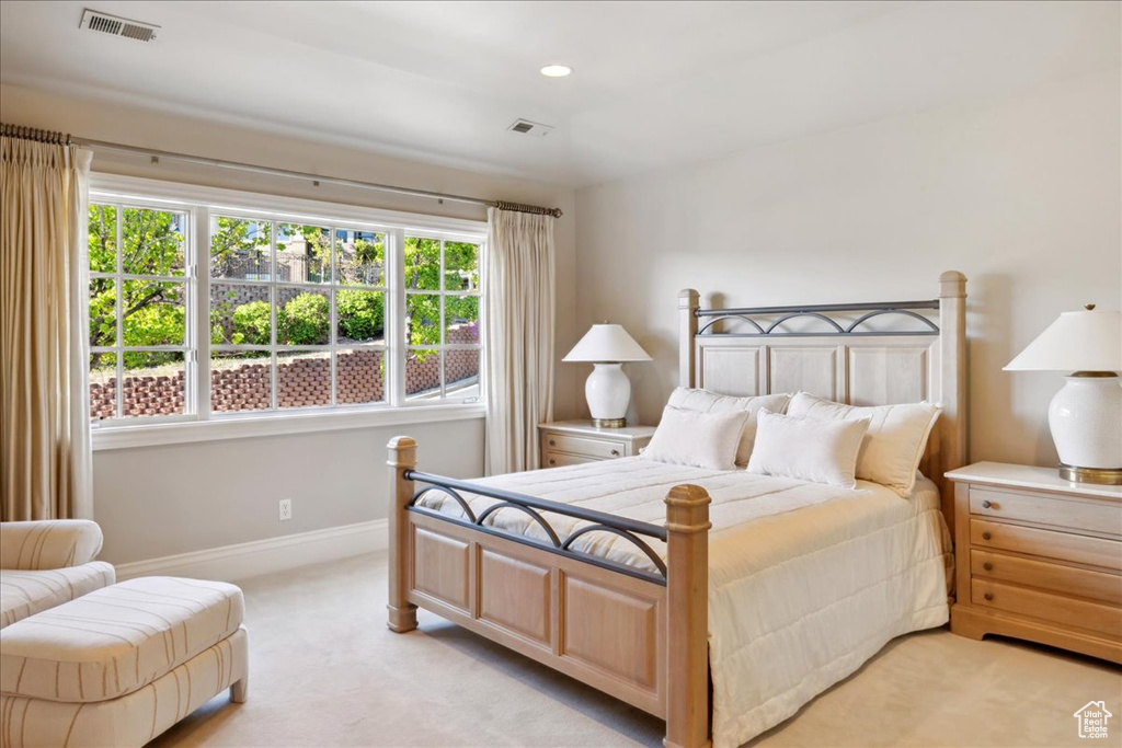 Bedroom with baseboards, recessed lighting, visible vents, and light colored carpet