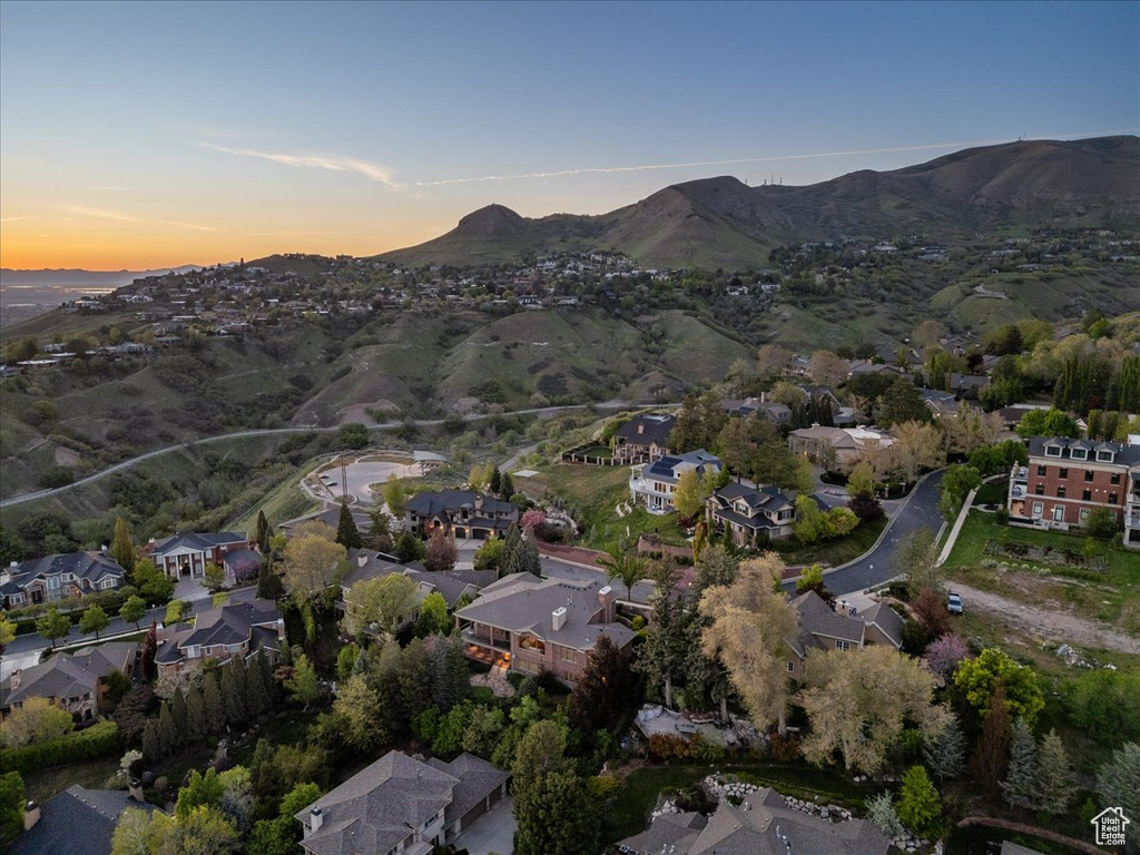 Birds eye view of property with a mountain view and a residential view