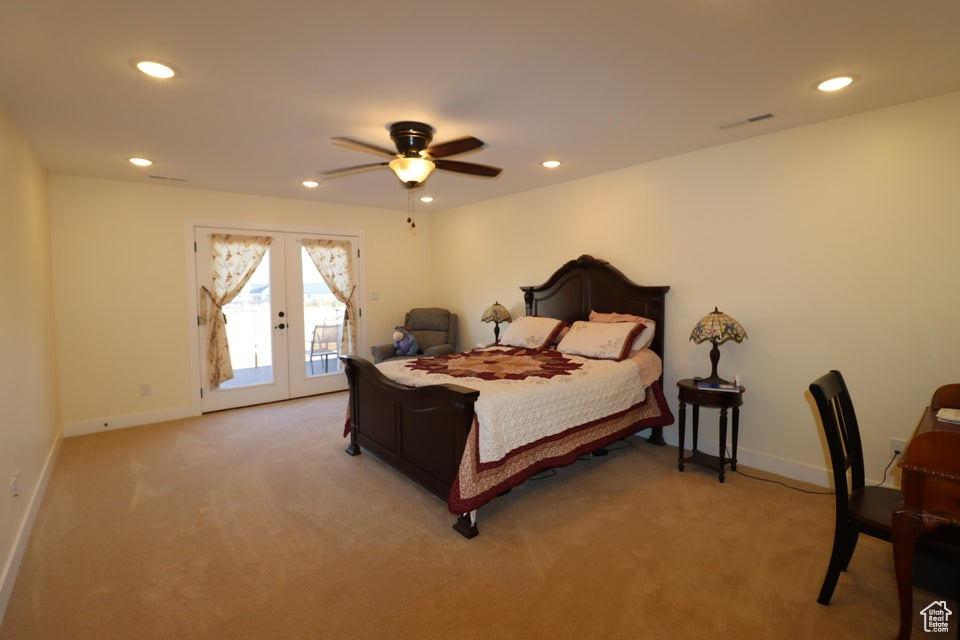 Bedroom with access to outside, french doors, and recessed lighting