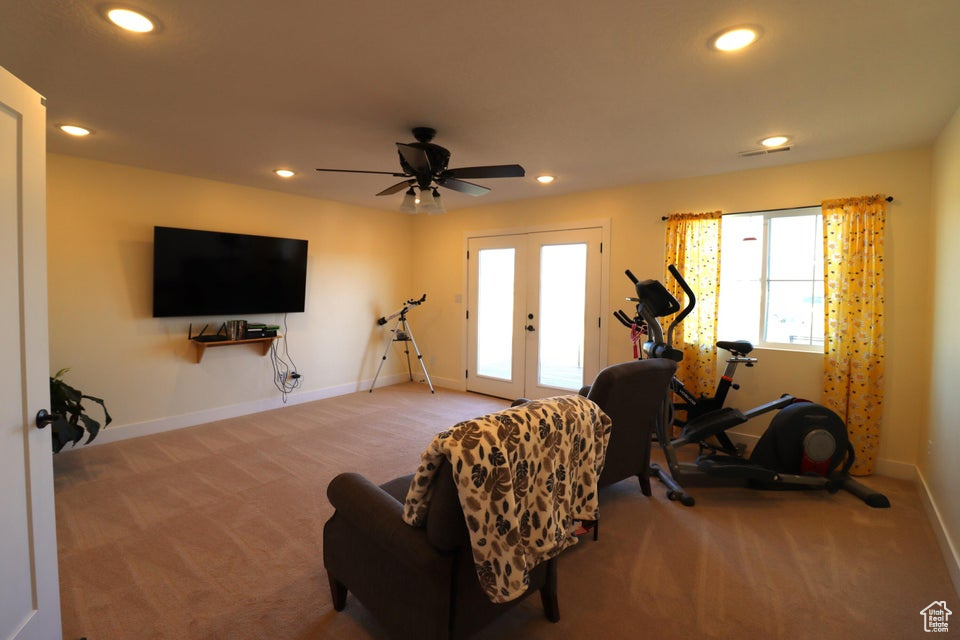 Living area with recessed lighting, french doors, and carpet floors