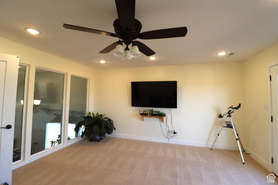 Exercise room featuring baseboards, ceiling fan, carpet flooring, and recessed lighting
