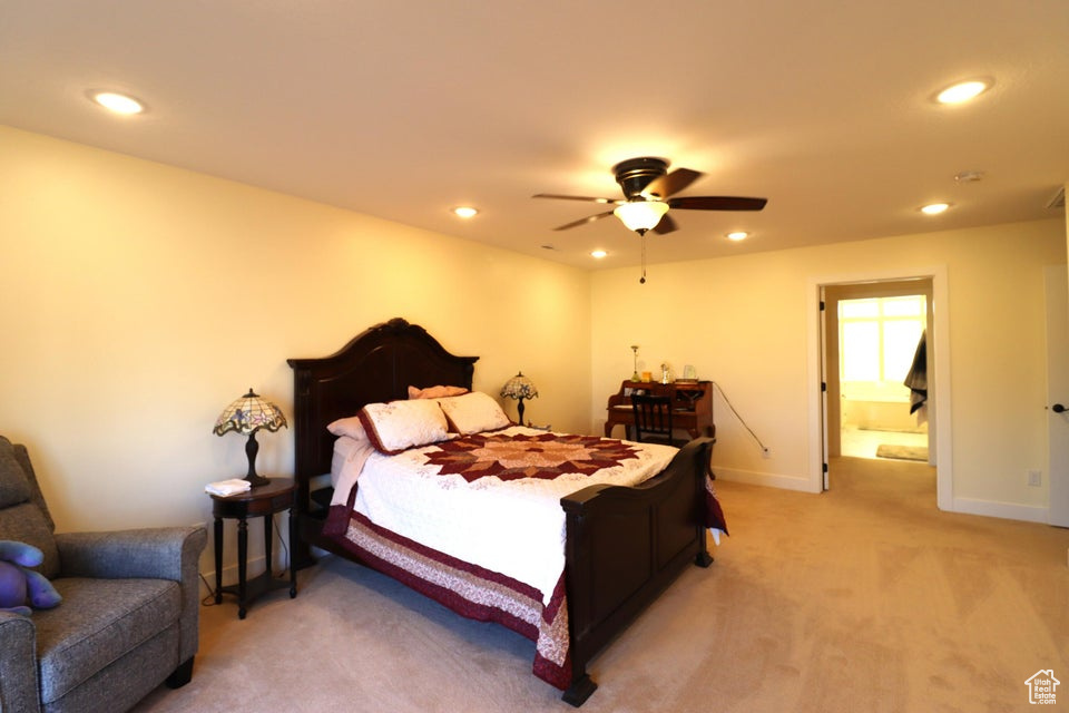 Bedroom featuring baseboards, ceiling fan, recessed lighting, and light colored carpet
