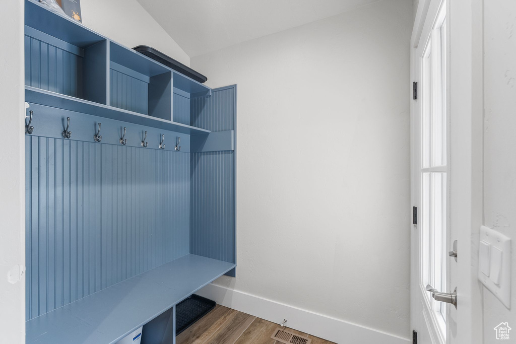 Mudroom featuring baseboards, visible vents, and dark wood-type flooring