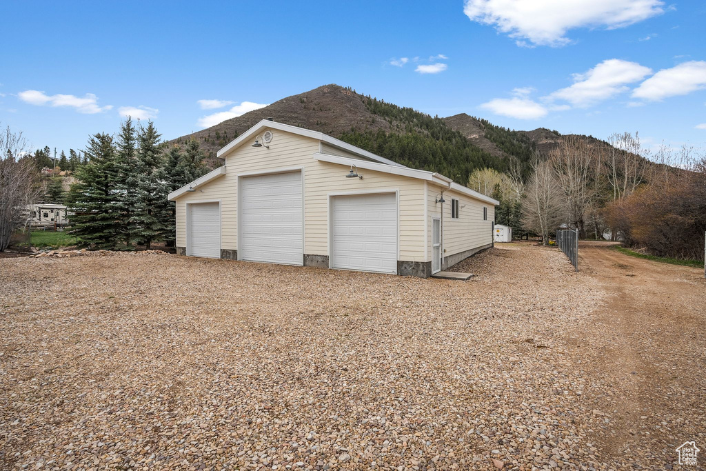 Detached garage with a mountain view