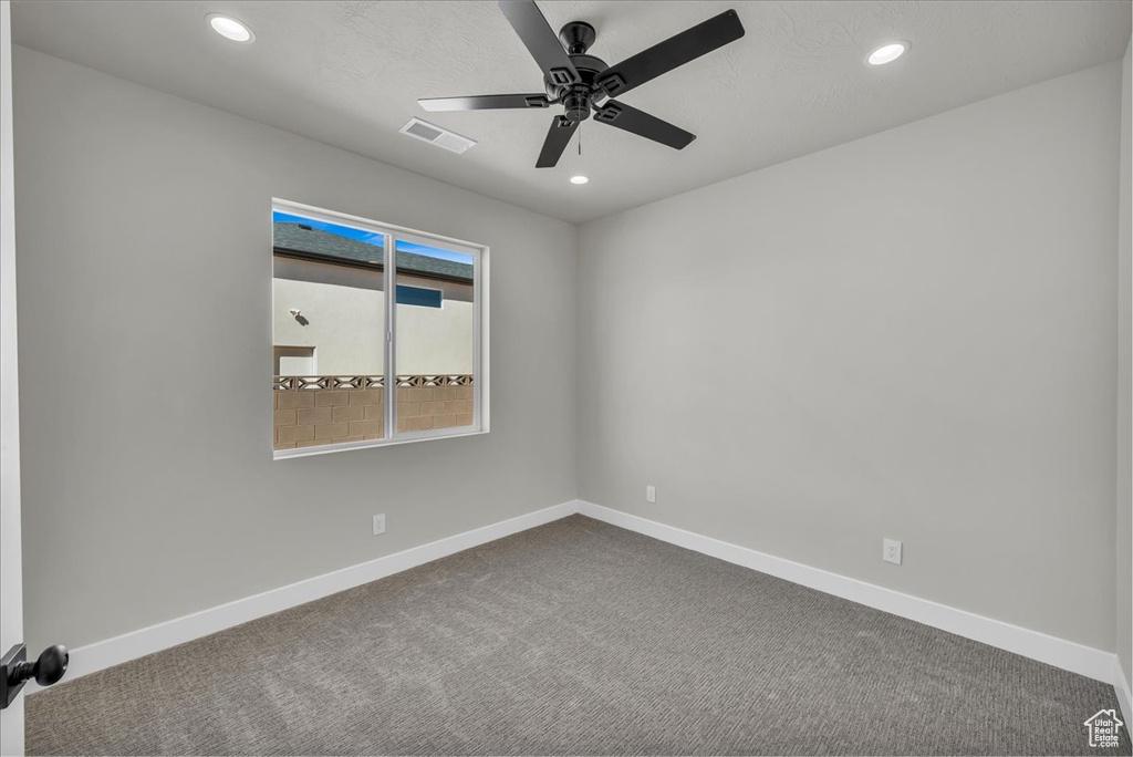 Spare room with visible vents, baseboards, a ceiling fan, and recessed lighting