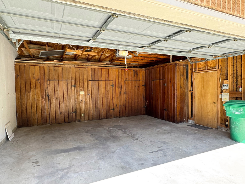 Garage featuring wooden walls