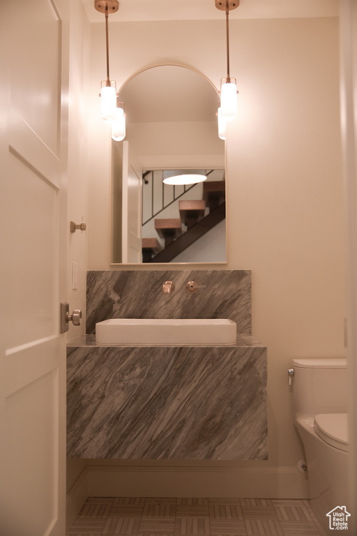 Half bathroom featuring toilet
