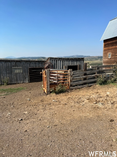View of yard with an outdoor structure and an exterior structure