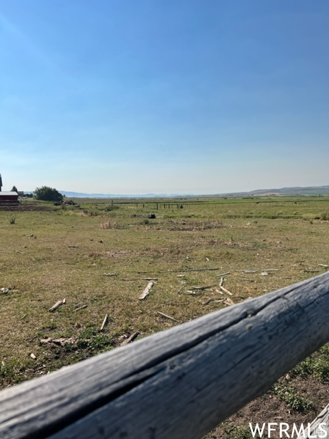View of yard with a rural view