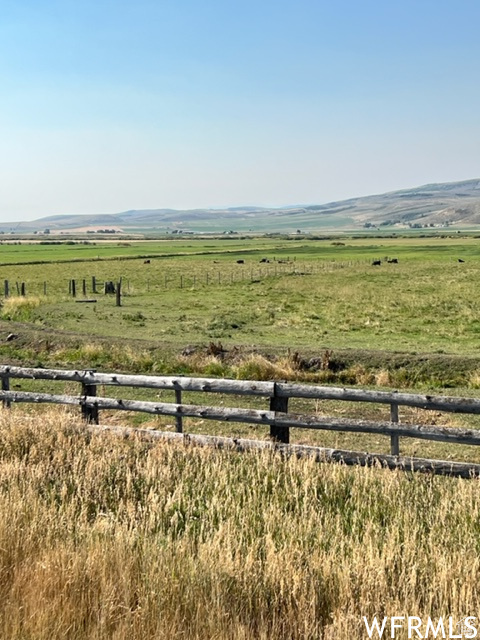 Exterior space with fence and a rural view