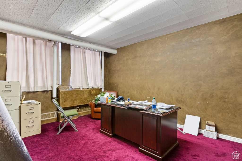 Office featuring dark colored carpet and visible vents