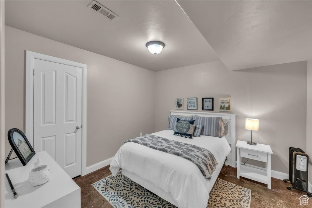 Bedroom with baseboards and visible vents