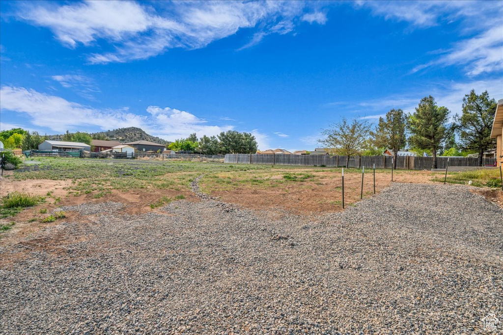 View of yard featuring fence