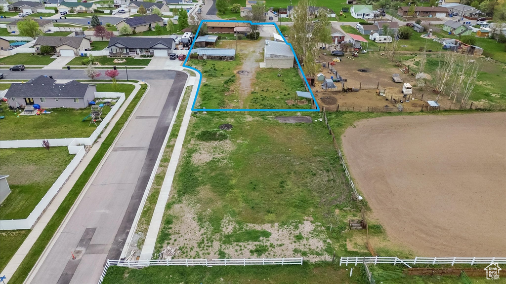 Aerial view of residential area with property parcel outlined