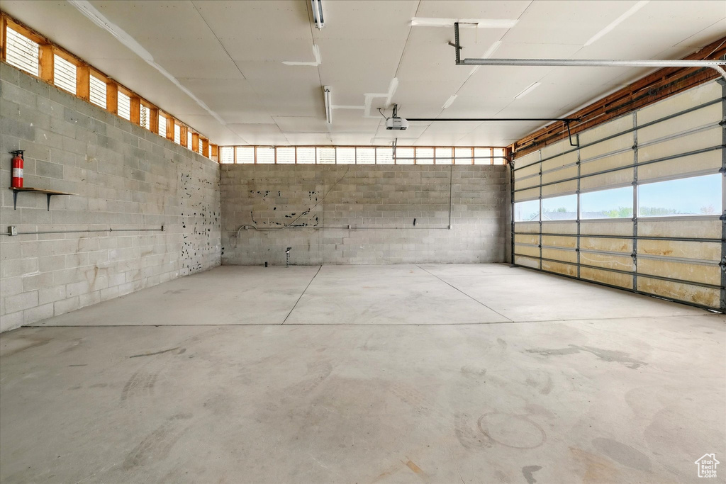 Garage featuring a garage door opener