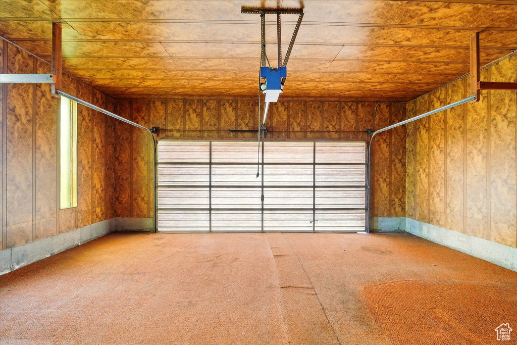 Garage featuring a garage door opener